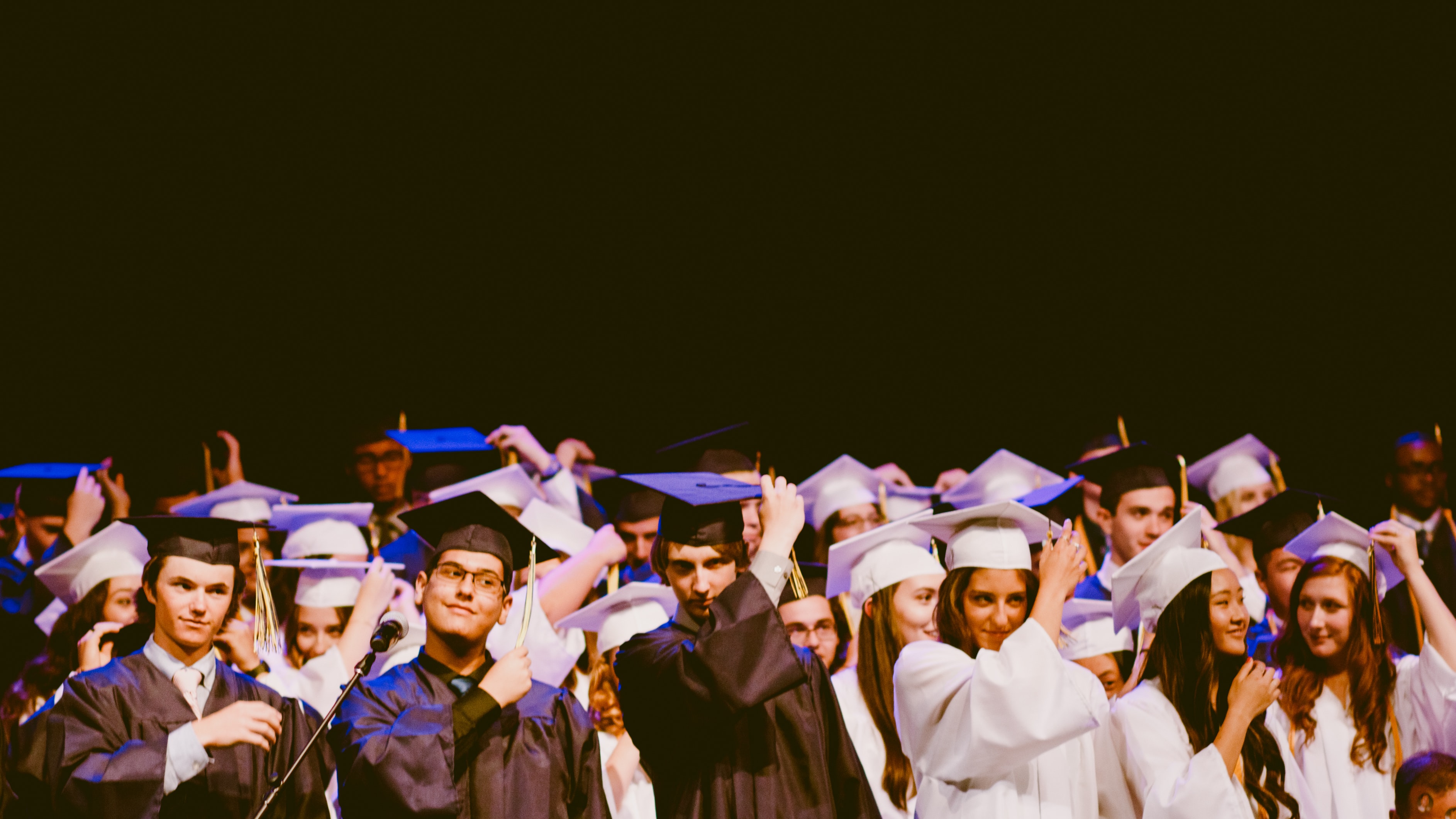 Graduate study abroad concept : Graduation cap on calendar paper